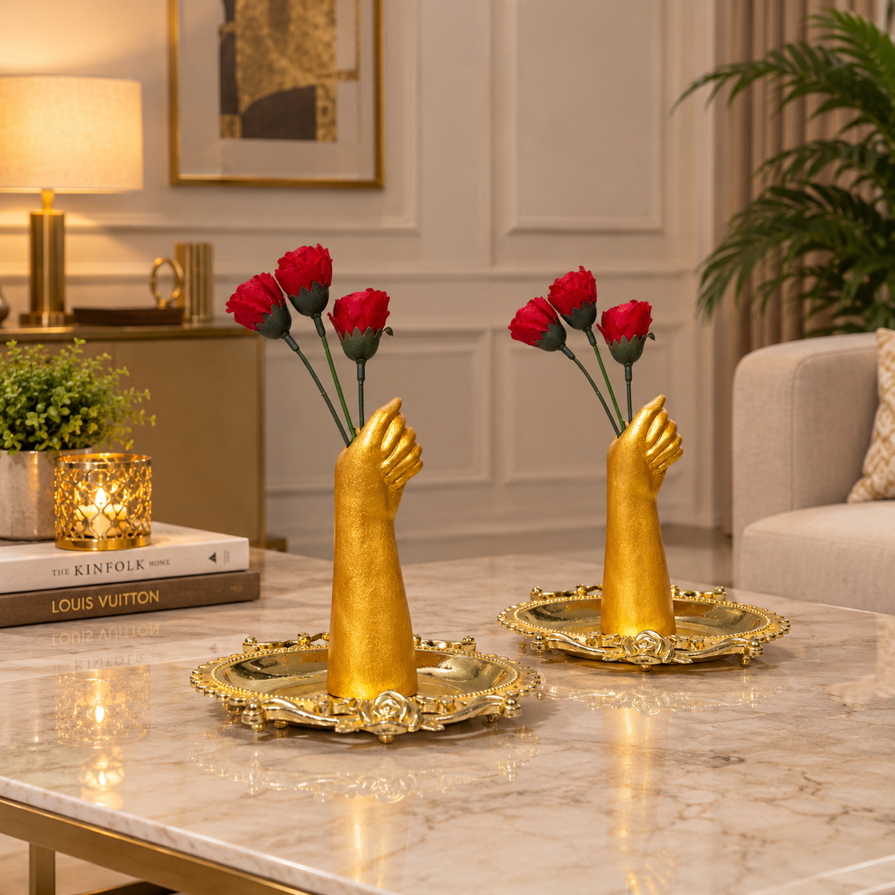 Gold Painted Hand Sculpture Vase holding three red flowers placed in a Golden tray