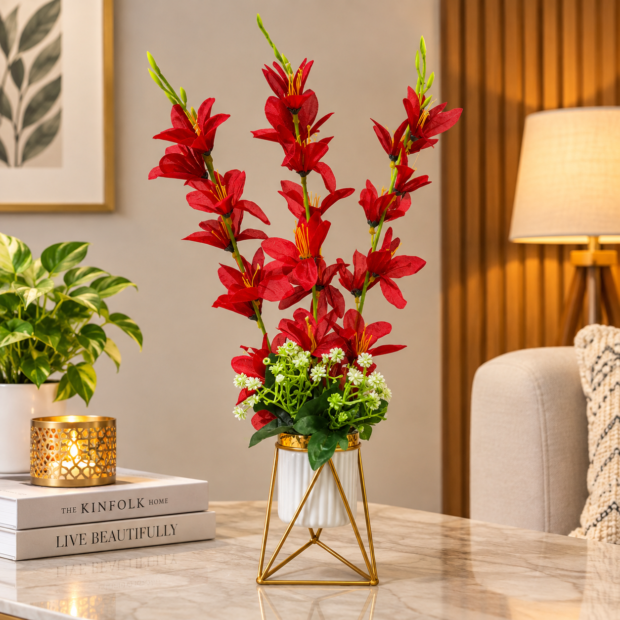 Artificial Red Gladiolus flower arrangement in a geometric golden metallic stand with a white pot