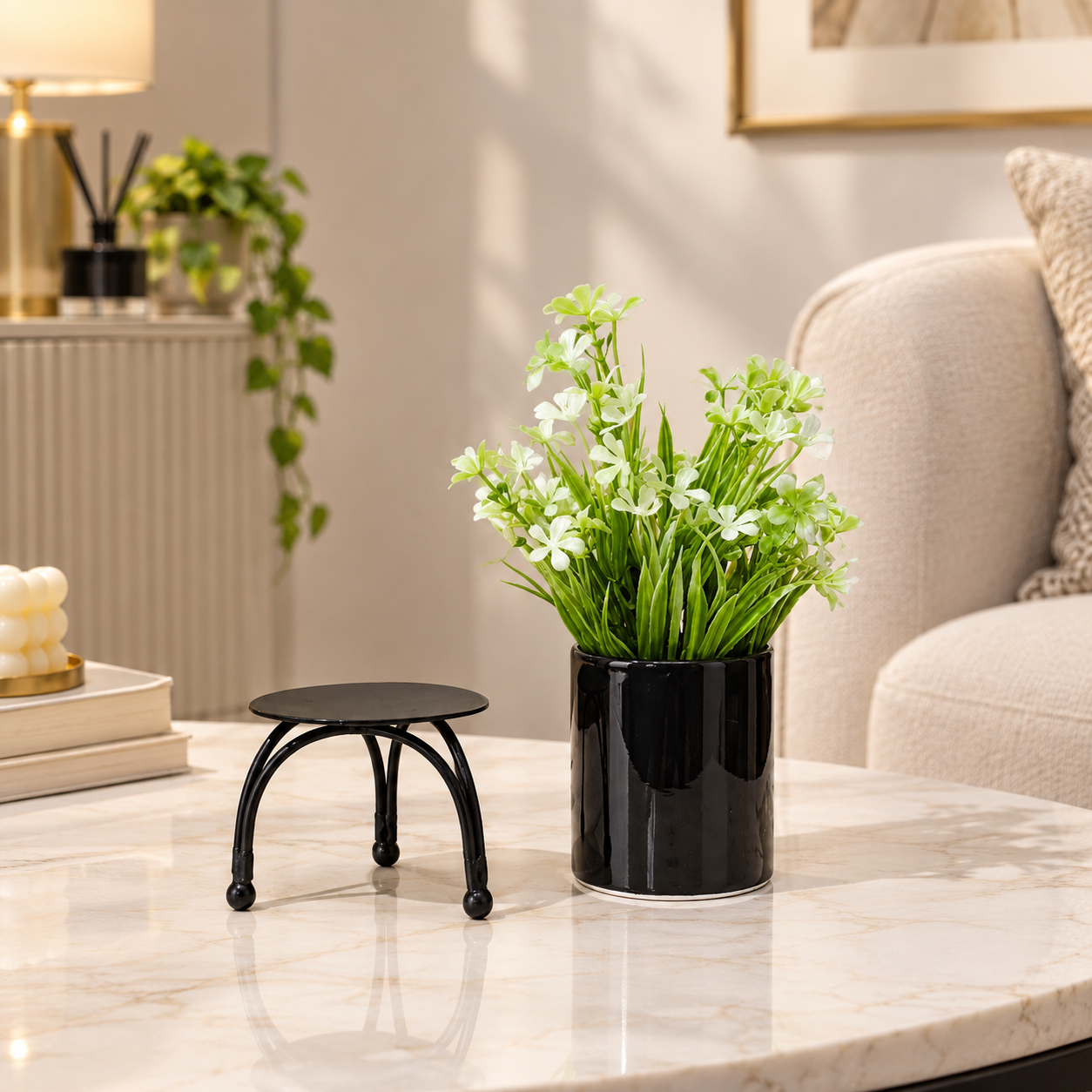 Black Ceramic Pot with Artificial White Flowers Plant on Black Curved Legs Metallic Stand