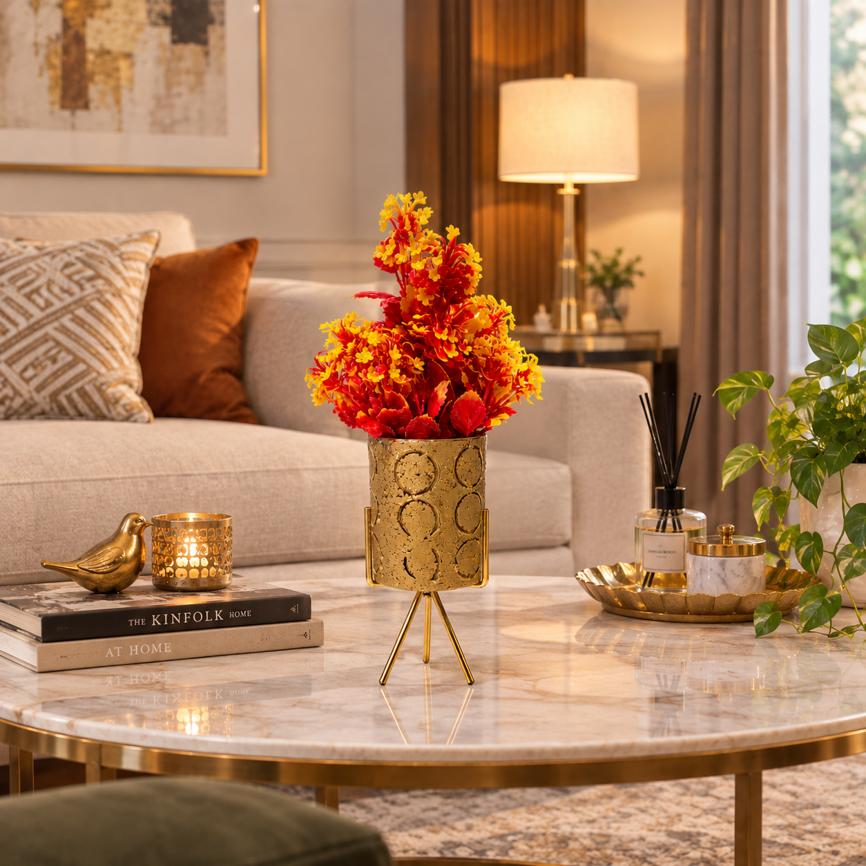 Golden Ceramic Pot with Artificial Red-Yellow Plant on a Golden Metallic Tripod Stand