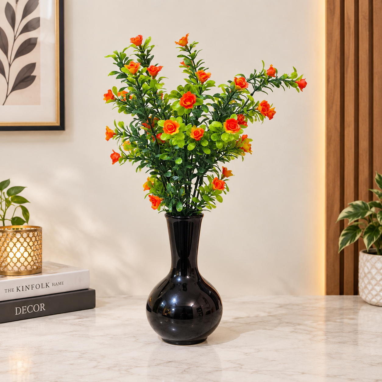 Black Ceramic Pot with a Bunch of Plastic Plant leaves & Orange flowers