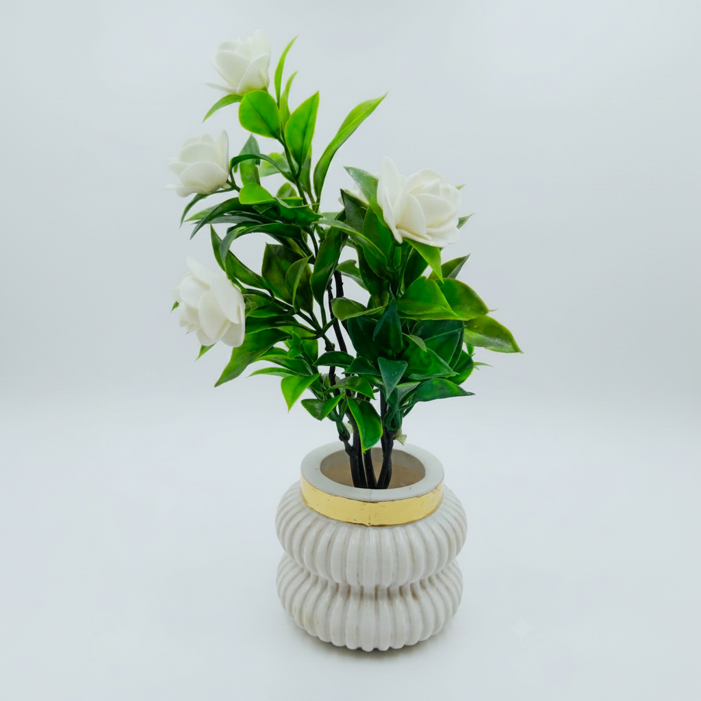 White Camellia-Style Blossoms and lush green foliage in a white, ribbed Plastic Pot