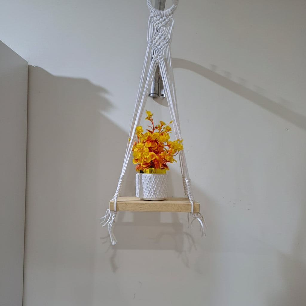 Handmade Macrame Plant Hanger with Orange Flowers Planted in White Plastic Planter