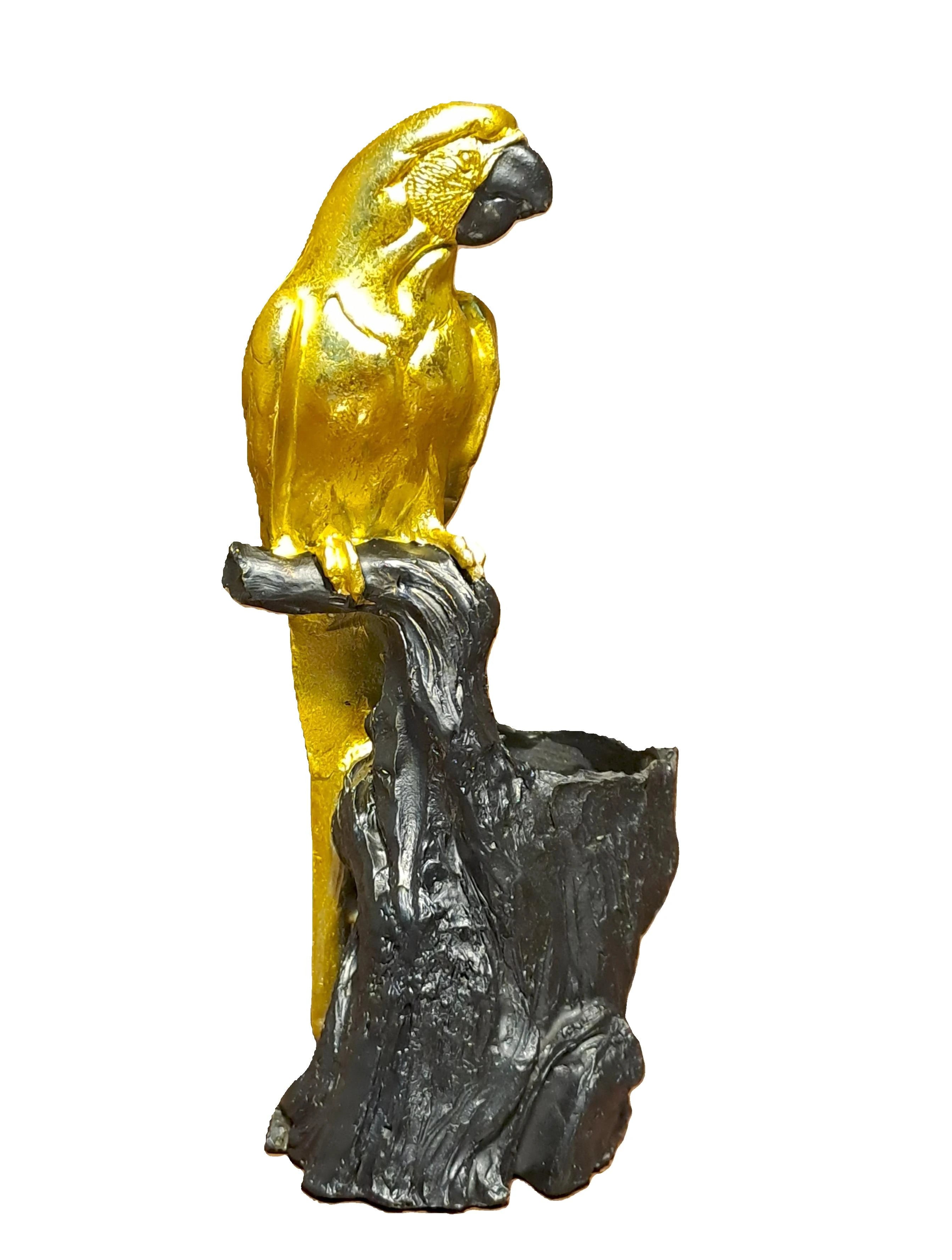 Golden Resin Parrot on Tree Stem