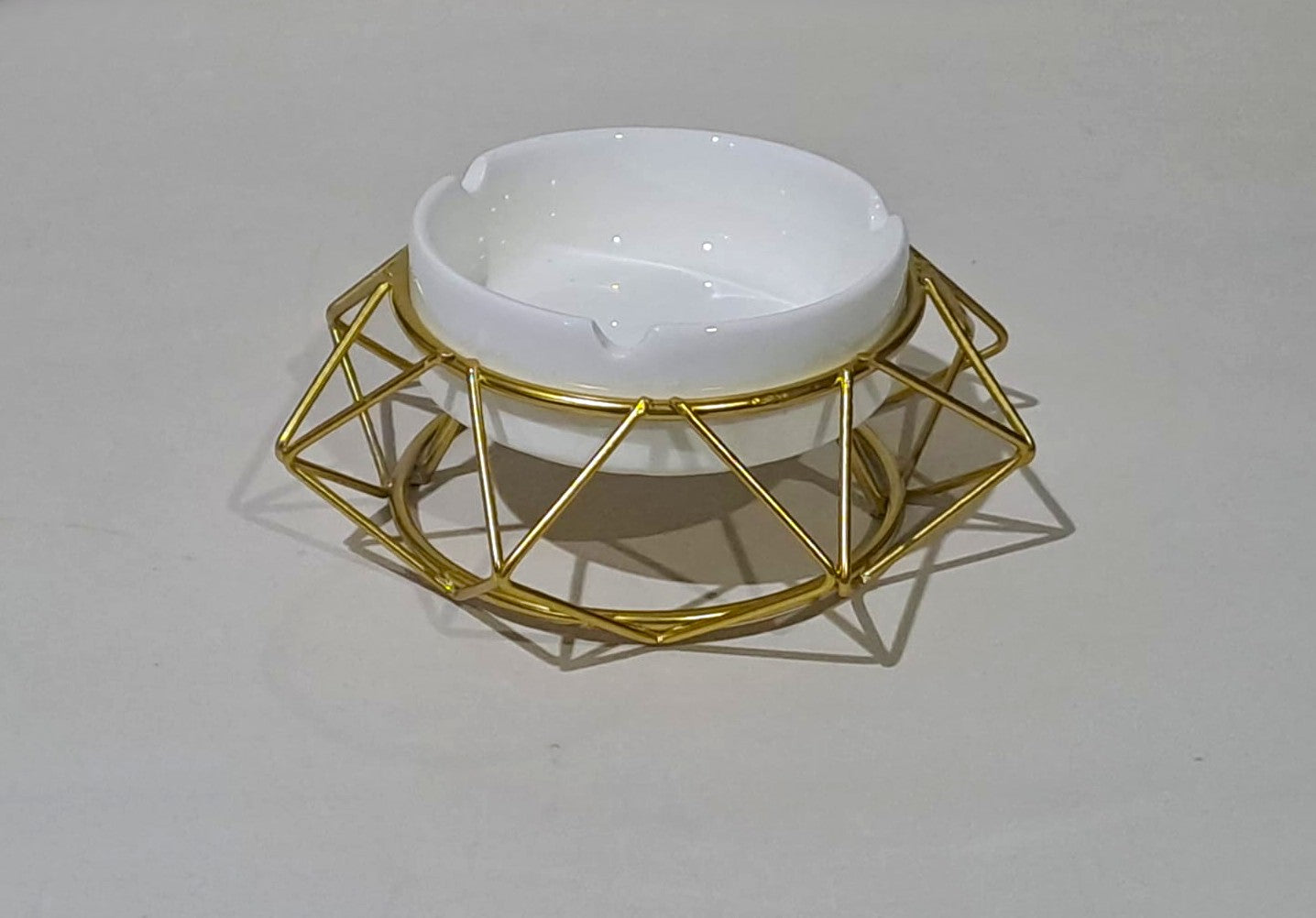 Ceramic Ashtray over a Golden Geometric Metal Stand