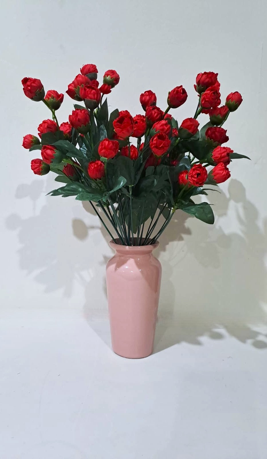 Salmon Pink Classic Ceramic Vase with 2 Bunches of Red flowers