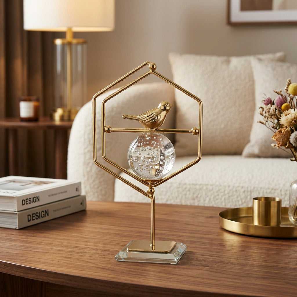 Golden Geometric tabletop ornament featuring Crystal Ball, Metallic Bird, and a clear glass base.