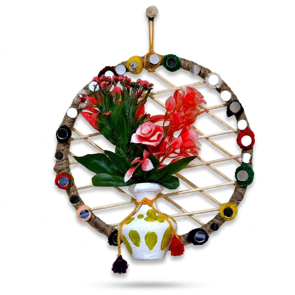 Handmade Circular woven stick framework wrapped in jute rope, decorated with mirror accents, a painted white pot, and artificial red and pink flowers