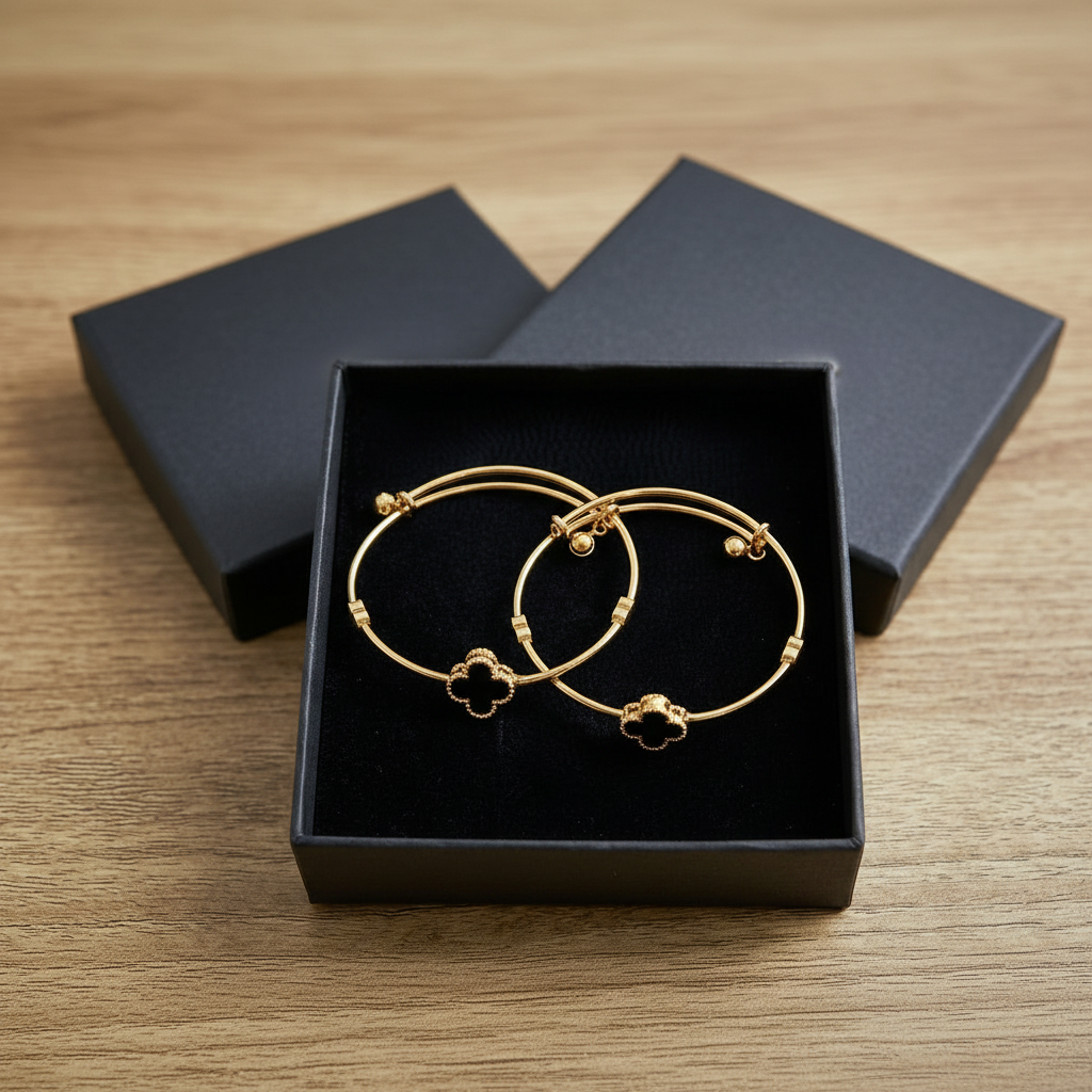 Pack of 2 Golden Bangles with Black Onyx Clovers and Heart Charms in Gift Packing