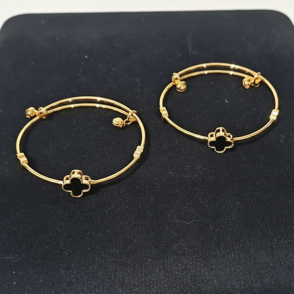 Pack of 2 Golden Bangles with Black Onyx Clovers and Heart Charms in Gift Packing