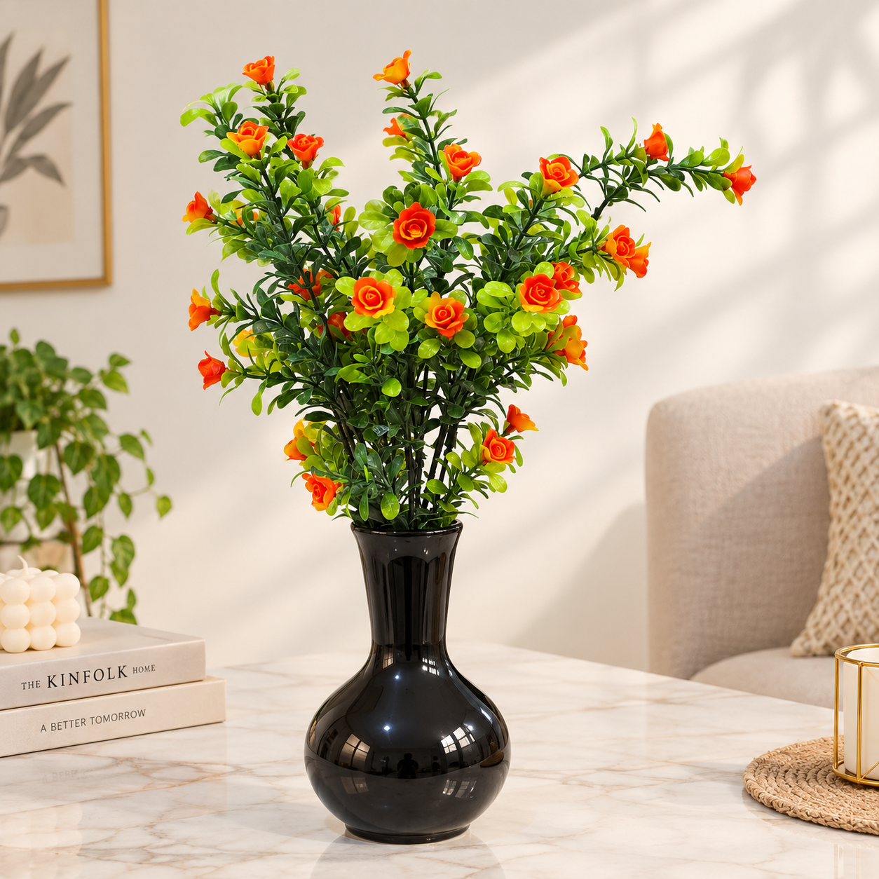 Black Ceramic Pot with a Bunch of Plastic Plant leaves & Orange flowers