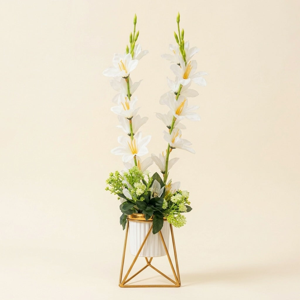 Artificial White Gladiolus flower arrangement in a geometric golden metallic stand with a white pot